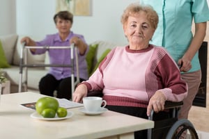 Older disabled woman on wheelchair in nursing home